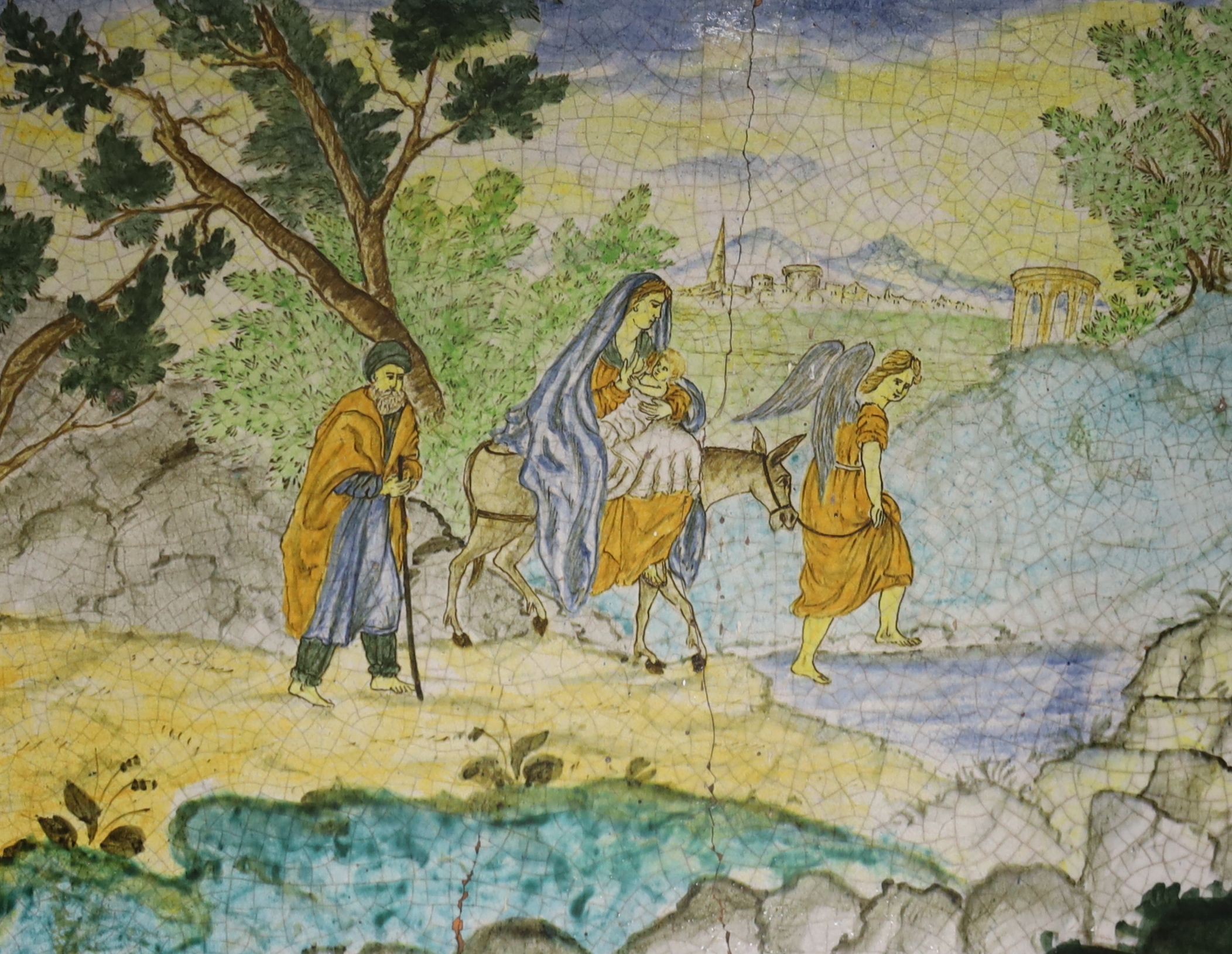 A 19th century Italian maiolica plaque decorated with the 'Return from Egypt', 27 x 35cm (a.f.)
